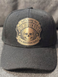 trucker hat with our Dumbfuckery patch in black and copper leather patch